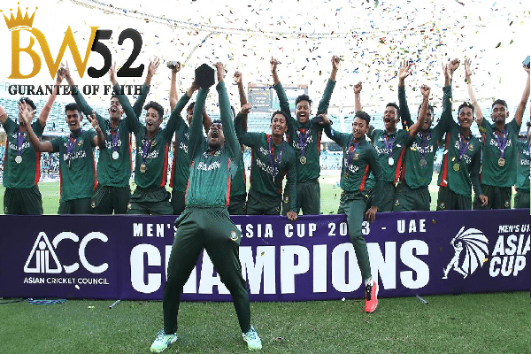 a group of people in green uniforms celebrating with confetti